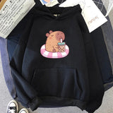 Capybara Floating & Sipping Bubble Tea Unisex Hoodie-Enchanted peach