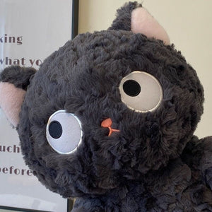 Jiji the Fluffy Black Cat Plushie Laying Down-Enchanted peach